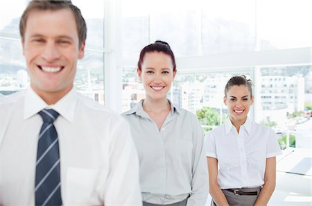 salesmen - Smiling young tradespeople standing in a line Stock Photo - Premium Royalty-Free, Code: 6109-06005775