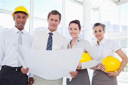 simsearch:6109-06005809,k - Smiling young architects together with a blueprint Stock Photo - Premium Royalty-Free, Code: 6109-06005797
