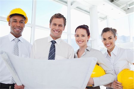 simsearch:6109-06005806,k - Smiling young architects together with a building plan Stock Photo - Premium Royalty-Free, Code: 6109-06005796