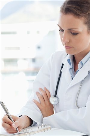 receta (médica) - Female doctor taking notes Foto de stock - Sin royalties Premium, Código: 6109-06005866