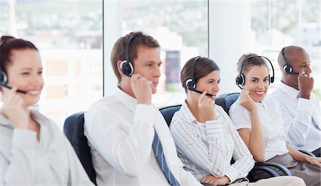 simsearch:6109-06005806,k - Young call center staff at work Stock Photo - Premium Royalty-Free, Code: 6109-06005804