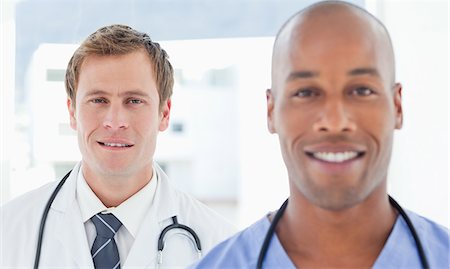 Young male doctors standing in arow Stock Photo - Premium Royalty-Free, Code: 6109-06005902