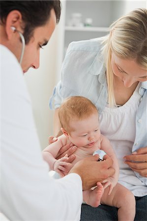 family clinic - Male doctor taking little babys heart beat Stock Photo - Premium Royalty-Free, Code: 6109-06006456