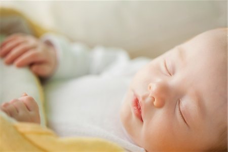 sleeping baby lying - Close up of sleeping cute baby Stock Photo - Premium Royalty-Free, Code: 6109-06006687