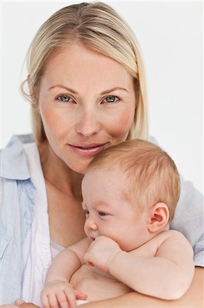 simsearch:6109-06006613,k - Close up of mother with her little baby against a white background Stock Photo - Premium Royalty-Free, Code: 6109-06006606