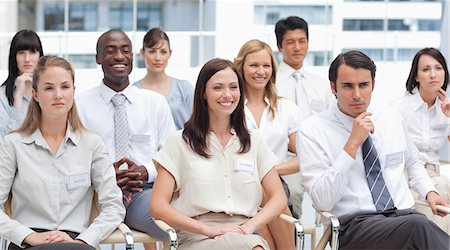 simsearch:6109-06007215,k - Mixed reactions given by colleagues who are sitting with each other Stock Photo - Premium Royalty-Free, Code: 6109-06007206