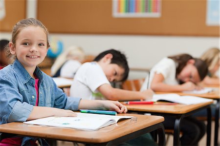 Side view of young schoolgirl during class Stock Photo - Premium Royalty-Free, Code: 6109-06007466