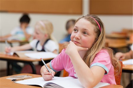 Young elementary student in thoughts Stock Photo - Premium Royalty-Free, Code: 6109-06007414