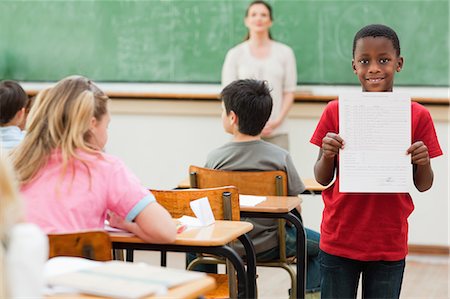 school result - Little pupil presenting his results Stock Photo - Premium Royalty-Free, Code: 6109-06007541