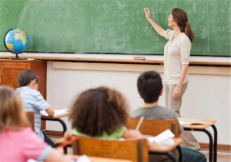 students reading in classroom - Elementary teacher giving math lesson Stock Photo - Premium Royalty-Free, Code: 6109-06007523