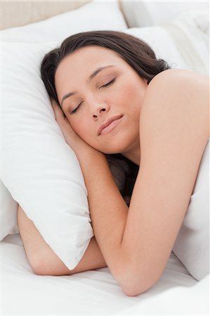 female face sleeping - Close-up of a woman sleeping in a bed Stock Photo - Premium Royalty-Free, Code: 6109-06194149