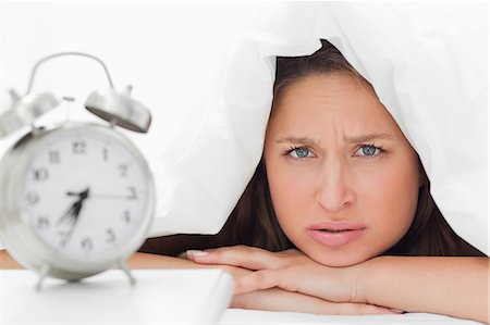 pillow close up - Young woman who doesn't want to wake up Stock Photo - Premium Royalty-Free, Code: 6109-06194412