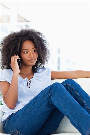 frizzy - Portrait of a woman with fuzzy hair making a call Stock Photo - Premium Royalty-Free, Code: 6109-06194557