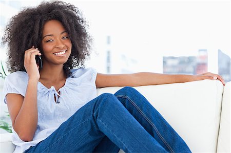 simsearch:6109-06194554,k - Portrait of a smiling woman with fuzzy making a call Stock Photo - Premium Royalty-Free, Code: 6109-06194555