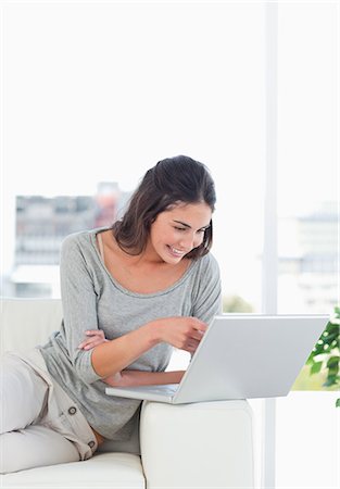 Young woman buying online Stock Photo - Premium Royalty-Free, Code: 6109-06194752