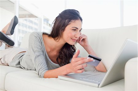 female computer shopping - Student using her credit card online Stock Photo - Premium Royalty-Free, Code: 6109-06194783