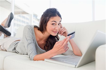 female computer shopping - Happy student using her credit card online Stock Photo - Premium Royalty-Free, Code: 6109-06194784