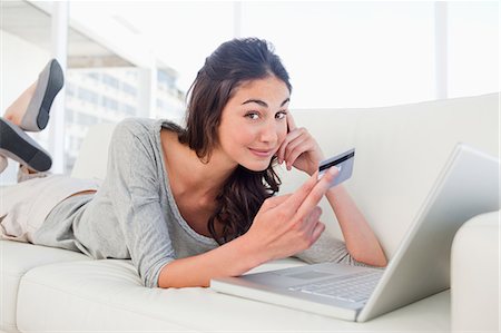 shop online card - Happy student using her credit card online Stock Photo - Premium Royalty-Free, Code: 6109-06194784