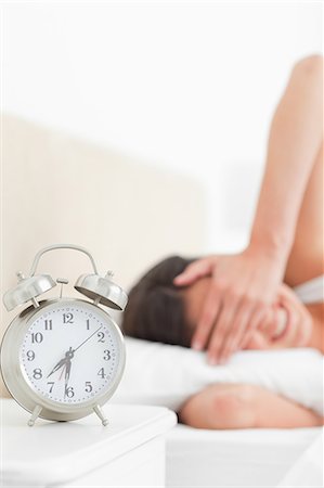 pillow close up - Brunette with a rude awakening Stock Photo - Premium Royalty-Free, Code: 6109-06194893