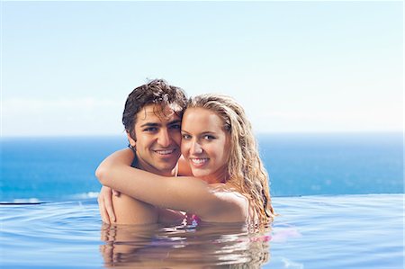 simsearch:6109-06195106,k - Happy couple embracing in the swimming pool Stock Photo - Premium Royalty-Free, Code: 6109-06195094