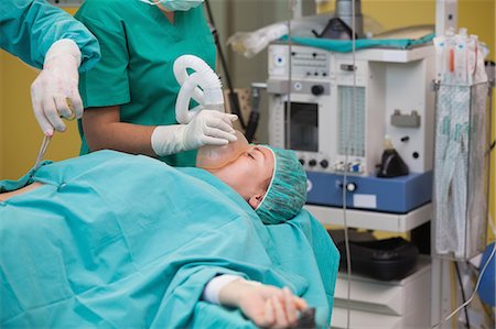 female patient oxygen - Unconscious patient with a mask Stock Photo - Premium Royalty-Free, Code: 6109-06195996