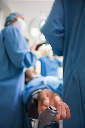 sleep at hospital - Focus shot of a hand tensiometer on a patient Stock Photo - Premium Royalty-Free, Code: 6109-06196029