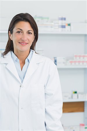 simsearch:6109-06196164,k - Female pharmacist standing in a pharmacy Stock Photo - Premium Royalty-Free, Code: 6109-06196144