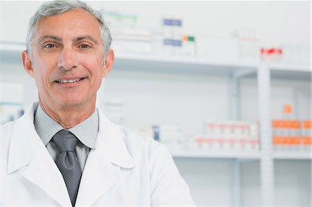 Portrait of a smiling surgeon in a pharmacy Stock Photo - Premium Royalty-Free, Code: 6109-06196168