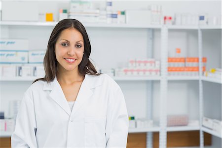 smiling doctor with lab coat - Smiling pharmacist in a pharmacy Stock Photo - Premium Royalty-Free, Code: 6109-06196236