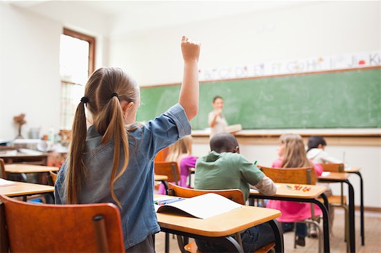 Back view of primary school student raising hand Stock Photo - Premium Royalty-Free, Image code: 6109-06196419