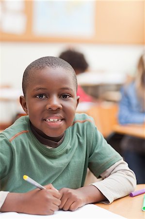 pupil - Student sitting at his desk Stock Photo - Premium Royalty-Free, Code: 6109-06196500