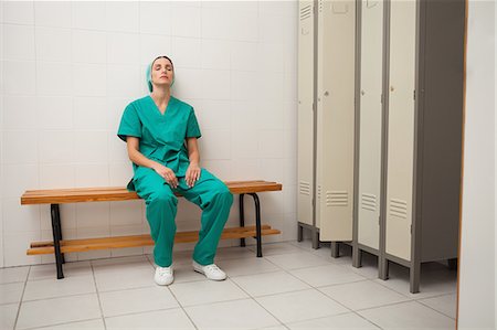 picture of woman in changing room - Nurse sitting on a bench Stock Photo - Premium Royalty-Free, Code: 6109-06684689