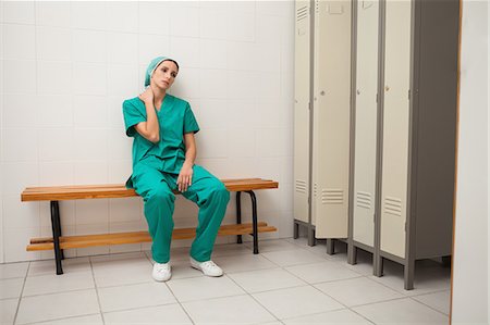 doctor in green uniform with hospital - Tired nurse sitting on a bench Stock Photo - Premium Royalty-Free, Code: 6109-06684690