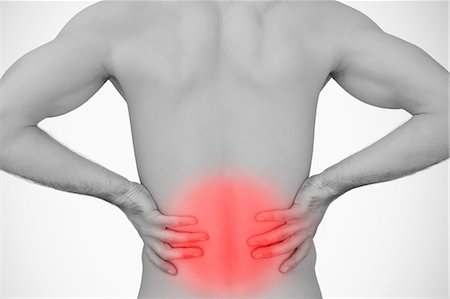 dolorido - Man holding his back with highlighted pain Photographie de stock - Premium Libres de Droits, Code: 6109-06684721