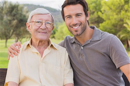 portrait of family on park bench - Portrait of father and adult son Stock Photo - Premium Royalty-Free, Code: 6109-06684871