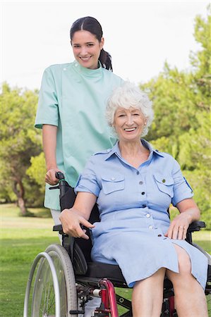 simsearch:6109-06684830,k - Portrait of nurse pushing elderly woman in wheelchair Stock Photo - Premium Royalty-Free, Code: 6109-06684835