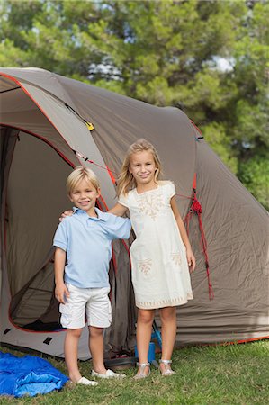 Portrait of smiling siblings at the camp site Stock Photo - Premium Royalty-Free, Code: 6109-06684956