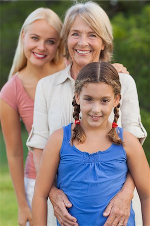 Three generations of women smiling together portrait Stock Photo - Premium Royalty-Free, Code: 6109-06684917