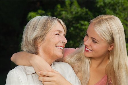 senior mother adult daughter hug - Mother and adult daughter hugging and looking at each other Stock Photo - Premium Royalty-Free, Code: 6109-06684920