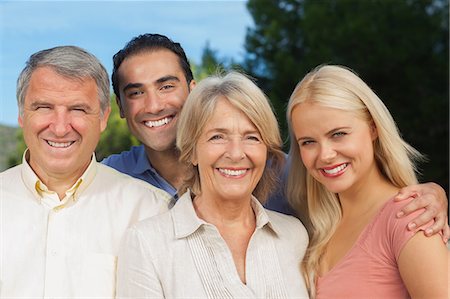 senior woman and son affection - Parents posing with adult offspring and partner Stock Photo - Premium Royalty-Free, Code: 6109-06684924