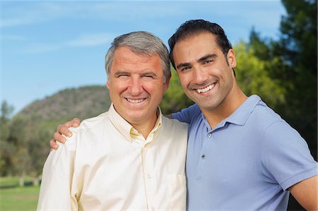 family on lawn - Father and adult son portrait Stock Photo - Premium Royalty-Free, Code: 6109-06684925