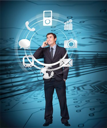 social networking illustration - Businessman on the phone admiring wheel of applications Stock Photo - Premium Royalty-Free, Code: 6109-06685044