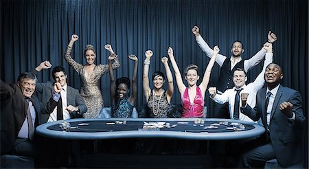 Attractive group cheering at the casino Foto de stock - Royalty Free Premium, Número: 6109-06685005