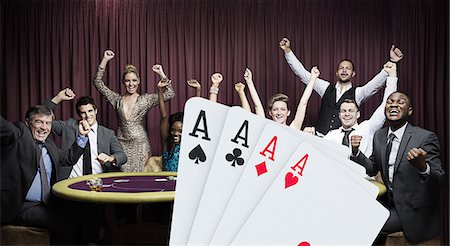 Attractive group cheering at the casino with digital hand of cards Foto de stock - Sin royalties Premium, Código: 6109-06685008