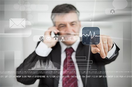 stock market - Businessman selecting stock application from touchscreen menu Stock Photo - Premium Royalty-Free, Code: 6109-06685021