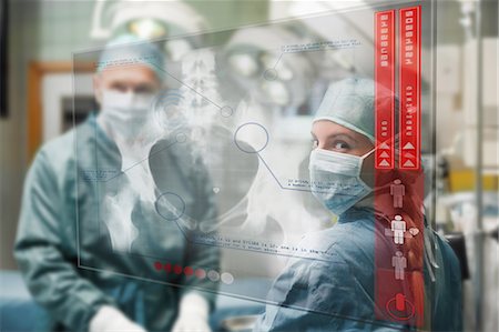 statistics - Surgeons checking holographic x-ray display Foto de stock - Sin royalties Premium, Código: 6109-06685029