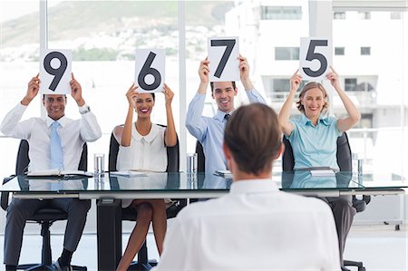 score (tally of points) - Sitting job applicant getting marks Stock Photo - Premium Royalty-Free, Code: 6109-06781349