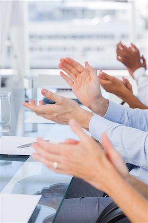executive at desk - Close up of clapping hands Stock Photo - Premium Royalty-Free, Code: 6109-06781355