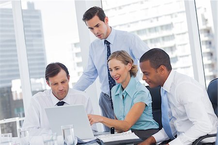Four business people in a meeting room Stockbilder - Premium RF Lizenzfrei, Bildnummer: 6109-06781375
