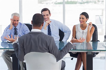 simsearch:6109-06781334,k - Man gesturing during an job interview Stock Photo - Premium Royalty-Free, Code: 6109-06781333